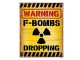 Žlutá nástěnná cedule Warning Bombs Dropping - 20*1*25 cm Clayre & Eef