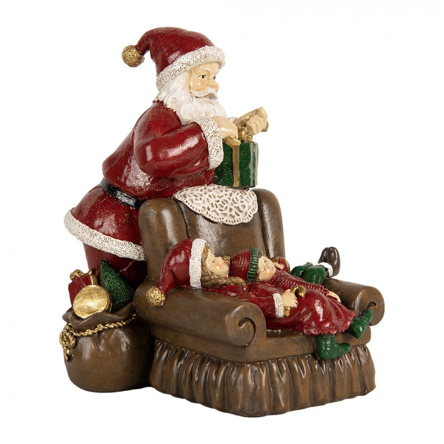 Červená vánoční dekorace Santa stojící u křesla s dětmi - 17*13*18 cm Clayre & Eef Červená vánoční dekorace Santa stojící u křesla s dětmi - 17*13*18 cm Clayre & Eef