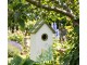Zeleno-bílá dřevěná ptačí budka s konvalinkami Birdhouse - 15*10*22 cm Clayre & Eef
