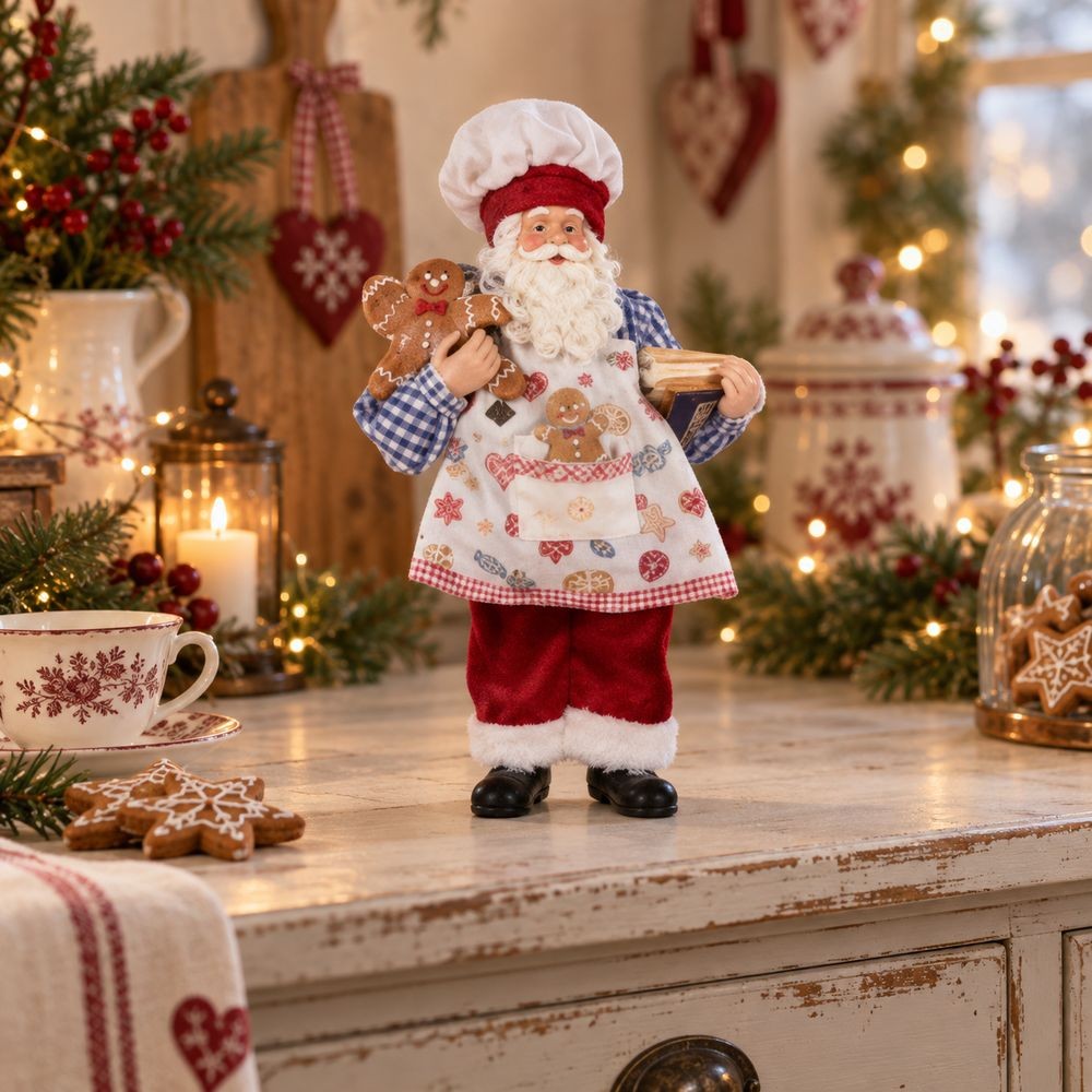 Vánoční dekorace Santa v zástěře s perníčkem - 15*10*26 cm Clayre & Eef Vánoční dekorace Santa v zástěře s perníčkem - 15*10*26 cm Clayre & Eef
